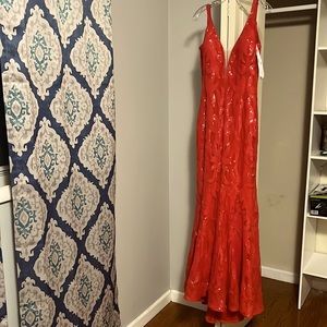 Stunning Red Jovanii Prom dress. Mermaid cut with low back